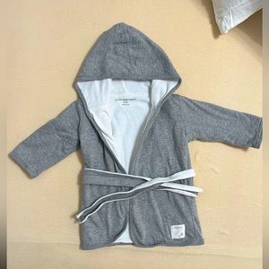 Burt’s Bees baby bathrobe on gray